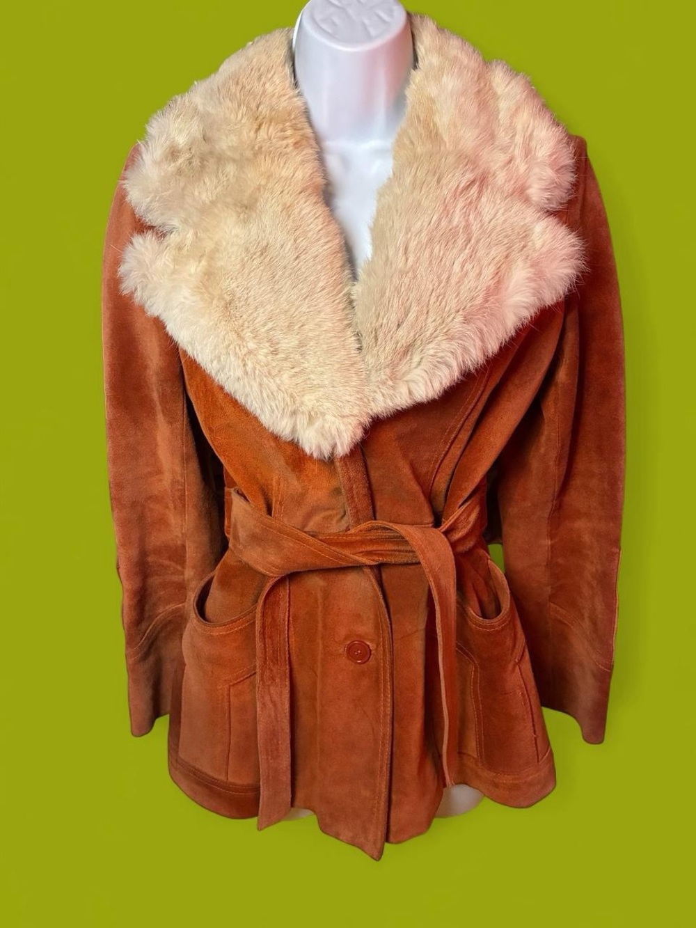 Vintage 1970s rust-orange suede coat featuring a wide rabbit fur collar